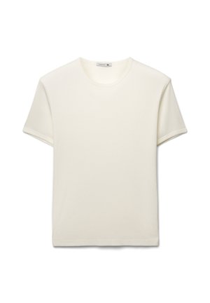 Maglietta a girocollo in bianco sporco, maniche corte, tessuto costellato a coste, vestibilità ampia. Etichetta all'interno del collo con taglia XL.