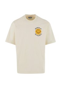 T-shirt beige à manches courtes en coton, avec un visage souriant jaune imprimé et le texte "MARKET STUDIOS" en noir.