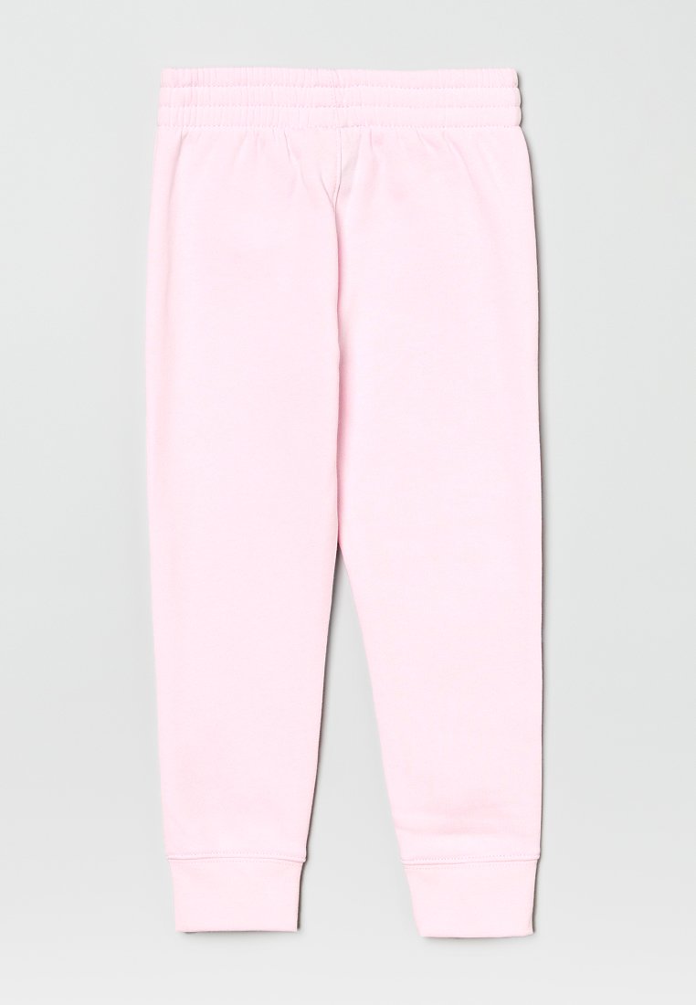Pantalons de survêtement rose clair fabriqués dans un matériau doux, dotés d'une taille texturée et de poignets ajustés à la cheville. Design simple et décontracté.
