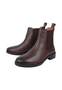 Brązowe skórzane botki Chelsea z elastycznymi panelami bocznymi, teksturowanym wykończeniem, okrągłym noskiem i pętlami do łatwego zakładania; czarna gumowa podeszwa zapewniająca przyczepność.