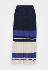 Medellång plisserad kjol i ett texturerat tyg. Har vågräta ränder i marinblått, blått och krämfärgat, med en glittrig finish. Elastisk midja.