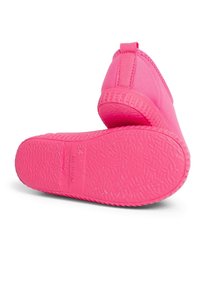 Pink slip-on shoe with a smooth upper material and textured rubber sole. Features a back loop tab for easy wearing. Durable and lightweight design.