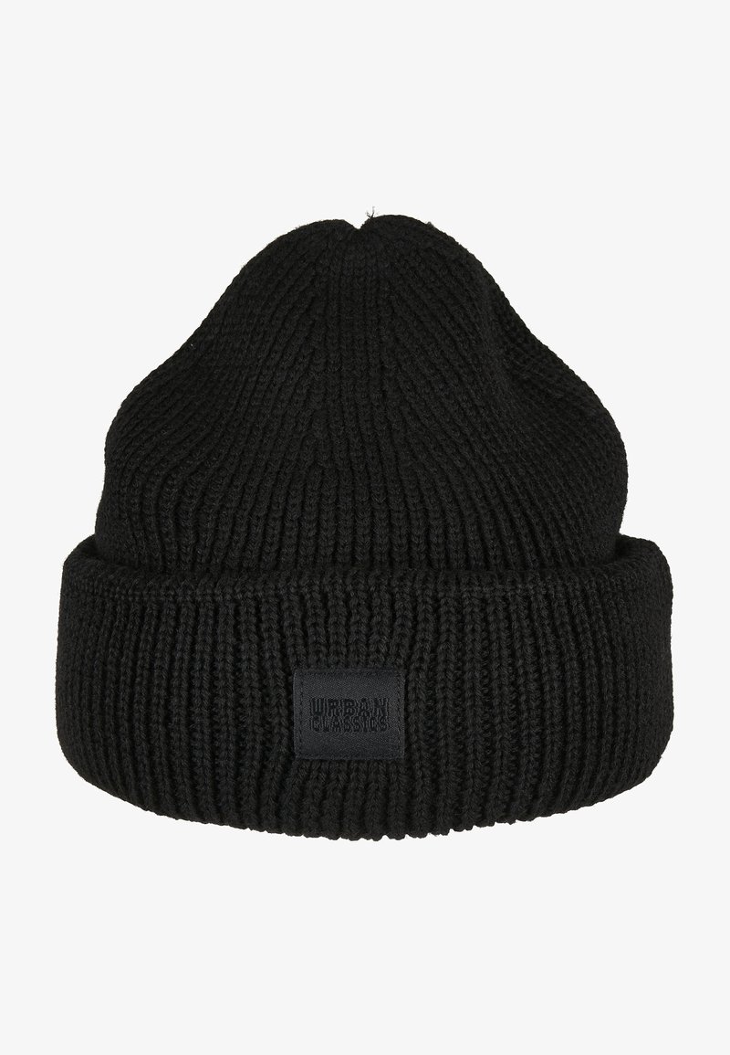 Black knit beanie with a ribbed texture, featuring a folded cuff and a rectangular black label on the side.