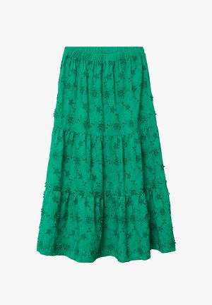 Jupe verte à volants avec ceinture élastique, ornée de motifs floraux brodés et de petites appliques de fleurs en tissu.
