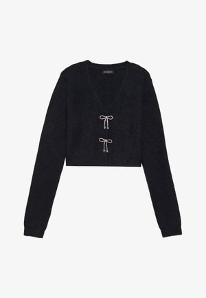 Maglione corto nero con scollo a V, tessuto a costine e maniche lunghe. Presenta due fiocchi decorativi con perline sul davanti.