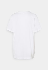 White cotton t-shirt featuring a classic crew neckline, short sleeves, and a relaxed fit with a smooth texture and no visible patterns.