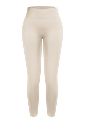 Leggings sin costuras de talle alto en beige con una cinturilla ancha acanalada, diseñados para un ajuste ceñido y cómodo.