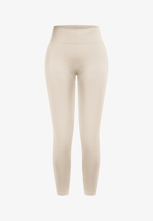 Leggings beiges taille haute sans coutures avec une large ceinture côtelée, conçus pour un ajustement près du corps et confortable.