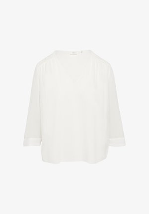 Bijela bluza s v-izrezom i rukavima do tri četvrtine, izrađena od mekanog materijala, sa teksturiranim detaljima na ramenima i opuštenim krojem. Jednostavan i čist dizajn.