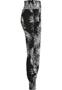 Pantalons à motif noir et blanc avec une taille élastique et des poignets, présentant une coupe ample et un design abstrait semblable à des plumes.
