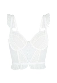 Witte lingerie met een kanten lijfje en een stippenpatroon, met ruches op de schouderbandjes en knoopdetails. Doorzichtige stof met een delicate textuur en een vrouwelijke uitstraling.