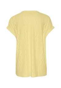 Keltainen paita, jossa on löysä istuvuus, lyhyet hihat ja aallokkomäinen kuvio sekä rei'itetty pinta kauttaaltaan. Näytetään takanäkymä.