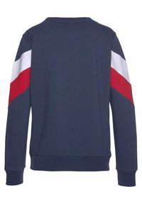 Sudadera de color azul marino con mangas largas, con rayas diagonales rojas y blancas en los hombros. Material de mezcla de algodón, corte relajado, dobladillo acanalado.