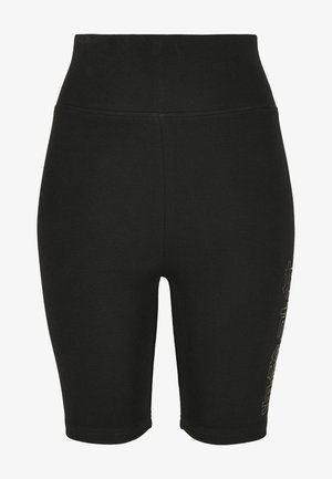 Musthave kõrgema pihaega mustad lühikesed püksid, mis on valmistatud elastse ja sileda tekstuuriga kangast. Küljel on kontrastse värviga logo.