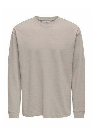 Beige genser med rund hals og lange ermer, med ribbestrikkede mansjetter og rett kant, laget av mykt og glatt stoff.