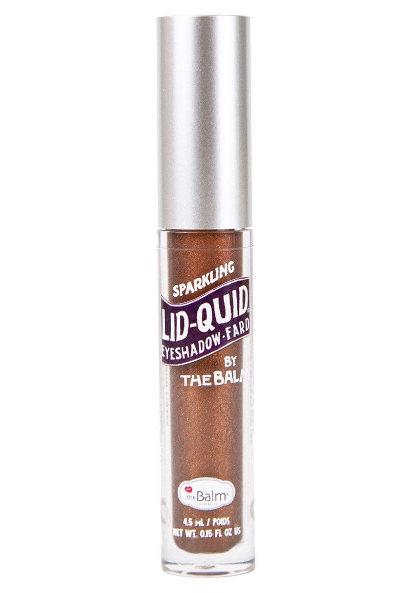 Vloeibare oogschaduw in een doorzichtig tube met een zilveren dop; heeft een schitterende bronzen kleur, gelabeld "Sparkling Lid-Quid" van The Balm.