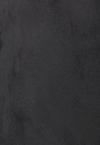 Soft black suede fabric texture with subtle variations and fine grain pattern visible in close-up view.