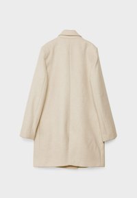 Beige wool coat with a tailored design, notched collar, long sleeves, and a straight cut. Features a vent in the back and minimal stitching.
