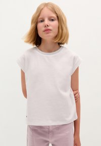 White short-sleeve t-shirt with a round neck featuring a silver-colored trim. The fabric appears smooth and lightweight.