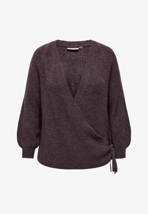 Kootestatud kudum, tumepunase lila värvi ja vormiga, millel on V-kaelus, puhvvarrukad ja külgside detail, mis tagab reguleeritava sobivuse. Pehme tekstuur ja soonikud varrukaotstes.