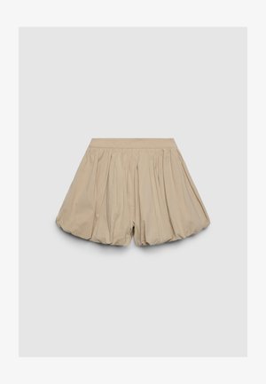 Beige bubble shorts with a gathered design and smooth texture. Elastic waistband. Short length with ample volume and flowy silhouette.