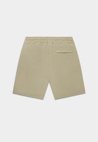 Pantaloni corti in cotone beige con vita elasticizzata, dotati di una tasca posteriore e ricamo del logo discreto. Texture liscia, design lunghezza ginocchio.