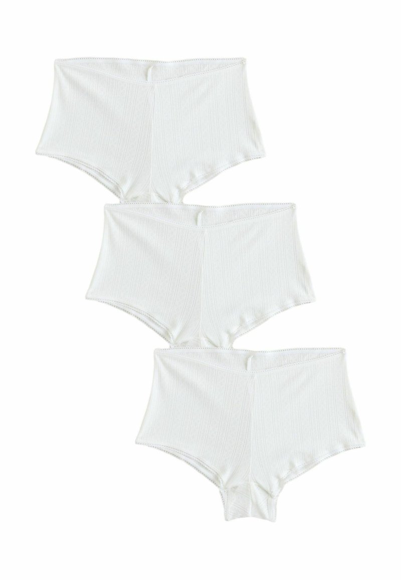 Witte katoenen high-waisted slipjes met verticale ribbelstructuur, voorzien van een zachte tailleband en een naadloze afwerking. Drie paar opgestapeld.