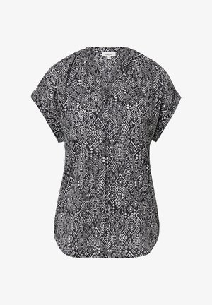 Blusa corta a maniche corte con motivo geometrico in bianco e nero, dalla vestibilità rilassata e design a V, caratterizzata da una texture di tessuto liscia.