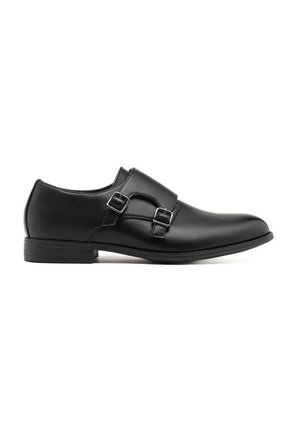 Chaussure habillée pour homme en cuir noir avec double boucle de moine argentée, dotée d'un petit talon et d'une finition lisse.