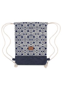 Dragsäck med ett marinblått geometriskt mönster på krämfärgad tyg, med en botten i denim och en brun läderdetalj.