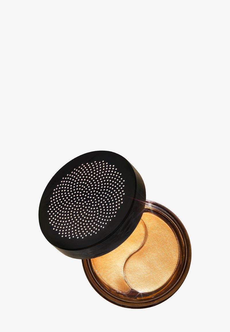 Pot de cosmétique rond avec une base transparente et un couvercle noir comportant de petits perforations. Contient deux coussinets en gel doré à l'intérieur.