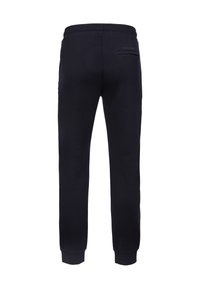 Marineblaue Jogginghose mit schmalem Schnitt, elastischem Bund, gerippten Bündchen und einer einzelnen Gesäßtasche. Hergestellt aus weichem Baumwollmischgewebe.