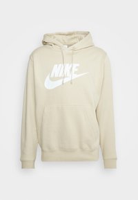 Béžová mikina s kapucí vyrobená z bavlněné směsi, s přední kapsou, nastavitelnou stahovací kapucí a velkým bílým logem Nike přes hruď.