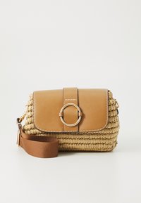 Woven straw handbag with a tan leather flap, gold circular hardware, and a brown adjustable strap. Features detailed stitching and texture.