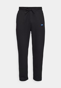 HUGO NANETTI - Pantalones deportivos - black
