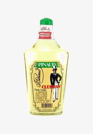 Bouteille transparente de lotion après-rasage Pinaud Clubman Classic Vanilla avec un capuchon vert, un liquide jaune et une étiquette vintage noire et rouge.