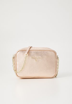 Metallic rose gold crossbody bag with textured leather, gold chain strap, zip closure, and embossed logo on the front.