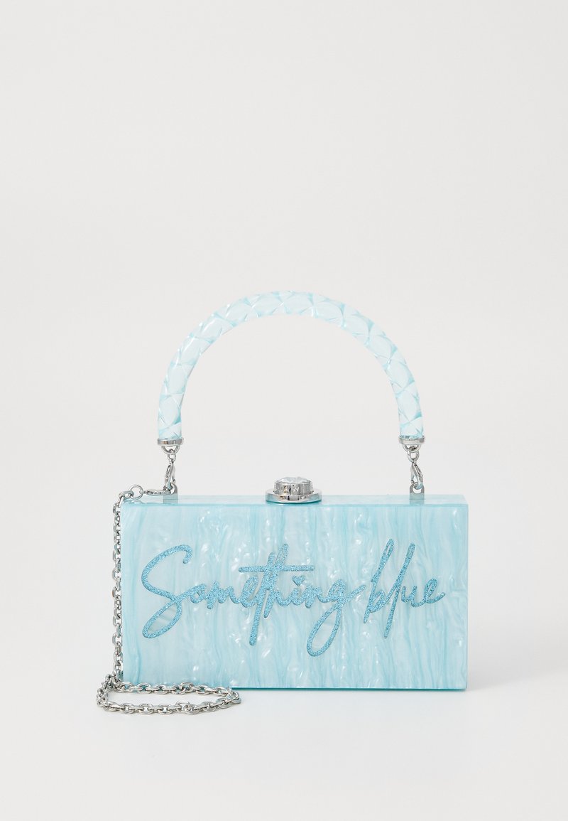 A rectangular light blue acrylic handbag with a braided clear handle, silver chain strap, and "Something blue" text in glitter.