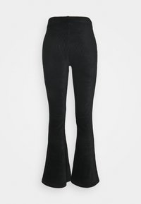 Svarta ribbade utsvängda byxor med midjeresår och texturerad tyg. Har en figurnära design från midjan till knäet, som vidgar sig vid nederkanten.