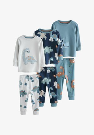 Tri sady detských pyžám s dlhými rukávmi v bielej, námorníckej modrej a modrej farbe, každá so živými ilustráciami dinosaurov na vrchných dieloch a zladených nohaviciach.