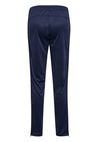 Marineblauwe sportbroek met elastische tailleband, taps toelopend ontwerp, gladde textuur en ritsen bij de enkels voor een verstelbare pasvorm.