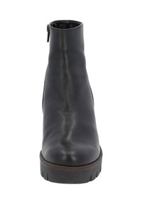 Bottine noire avec une finition en cuir lisse, fermeture éclair sur le côté, bout rond et semelle en caoutchouc épaisse avec un motif de treads pour une bonne adhérence.