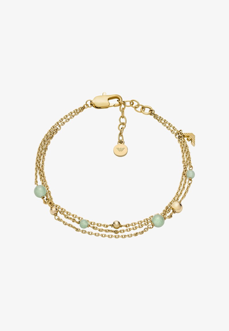 Auksinis grandinės apyrankė, sudaryta iš kelių sruogų, puošta žaliais karoliukais ir mažais auksiniais rutuliukais. Įeina krabų tipo užsegimas ir logotipo etiketė.