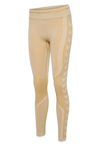 Beige Leggings mit hohem Bund, ausgestattet mit strukturierten Einsätzen, Chevron-Mustern in einer helleren Nuance und nahtlosen Designelementen.