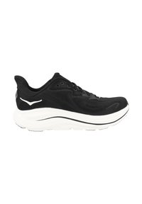 Chaussure de sport noire avec une tige texturée, une semelle intermédiaire blanche et une semelle extérieure noire. Présente un design épuré et des accents blancs contrastants.