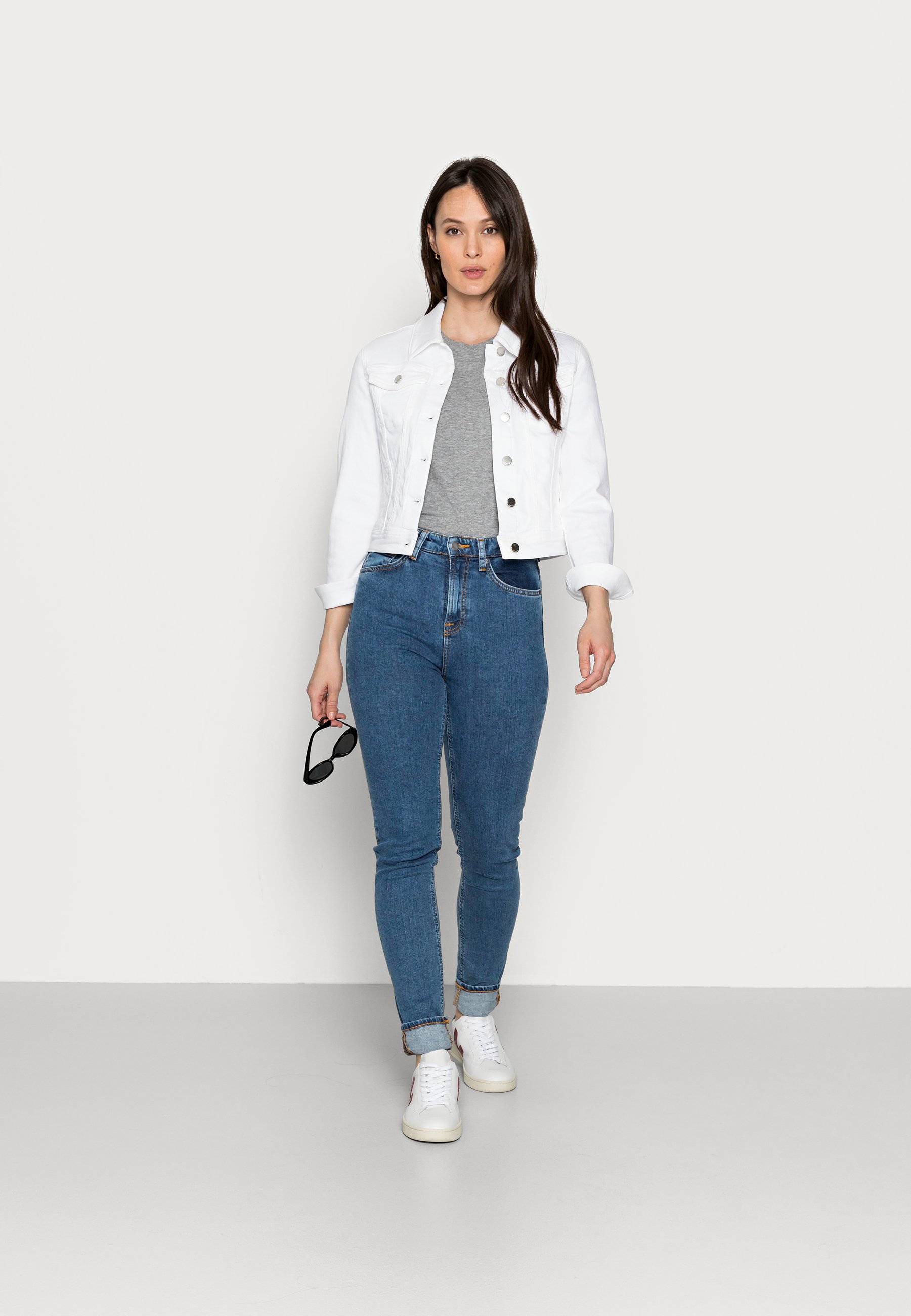 white jean jacket ripped