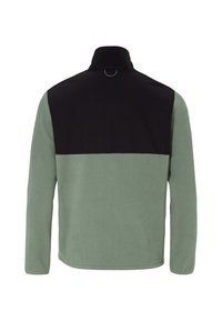 Giacca in pile con colletto alto, dotata di una sezione superiore nera e una sezione inferiore verde morbido. Tessuto liscio, maniche lunghe e hardware minimale.