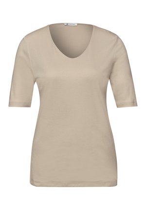 Camisa beige de manga corta con cuello en V y ajuste regular, mostrada sobre un fondo liso.