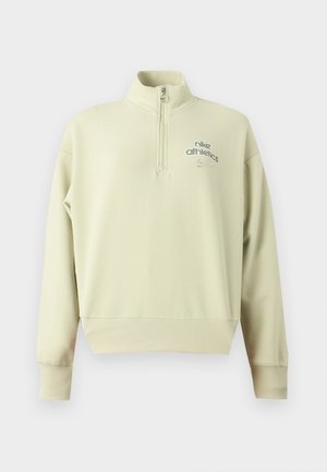 Ανοιχτό μπεζ μακρυμάνικο Nike Athletics πουλόβερ με μπροστινό μισό φερμουάρ και ριμπ μανσέτες και στρίφωμα.