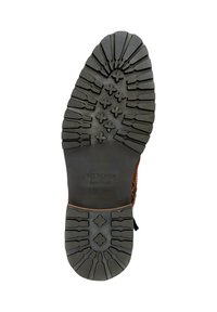 Soletta di stivale in pelle marrone con battistrada in gomma nera sagomata, progettata per la trazione, con la scritta "Wittchen" impressa. Design con tacco piatto e punta rotonda.